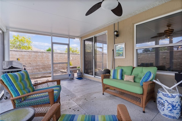 sunroom / solarium with ceiling fan