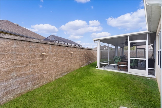 view of yard featuring a sunroom