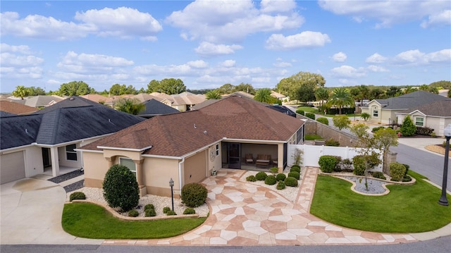 view of front of home featuring a front yard and a garage