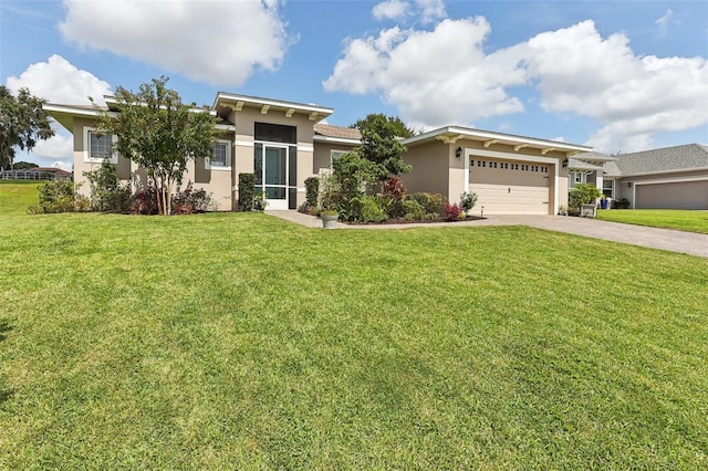 view of front of house featuring a garage and a front lawn