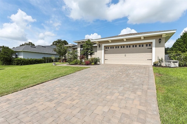 view of front of property with a garage and a front yard