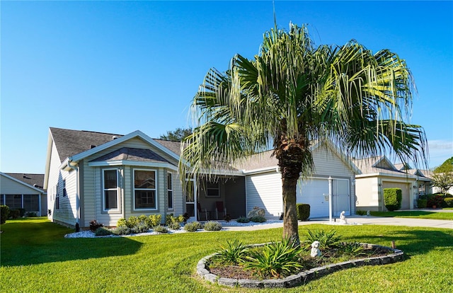 view of front of house with a front yard and a garage