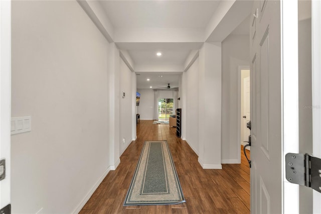 hallway with dark wood-type flooring