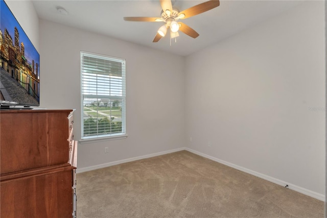 carpeted empty room with ceiling fan