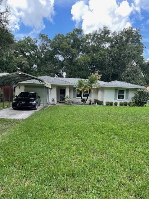 single story home with a front yard, a garage, and a carport