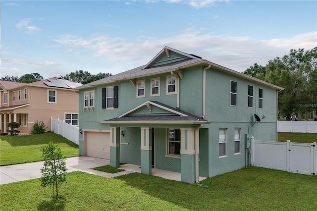 view of front of house with a porch, a garage, and a front yard