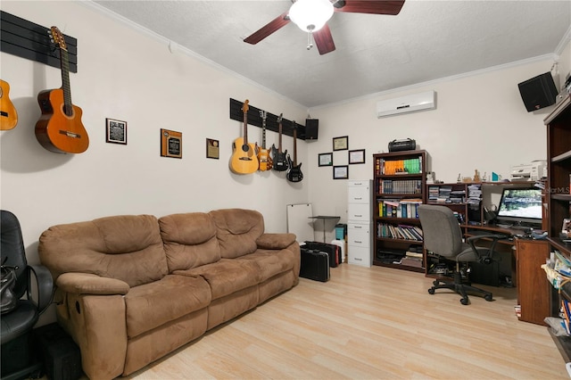 office space featuring a wall mounted AC, crown molding, light wood-type flooring, ceiling fan, and a textured ceiling