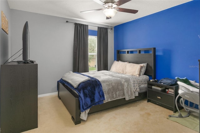 bedroom with light colored carpet and ceiling fan