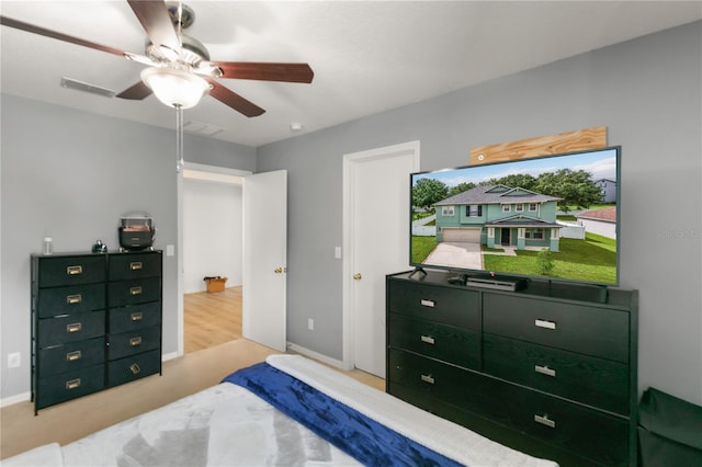 bedroom featuring light hardwood / wood-style flooring and ceiling fan