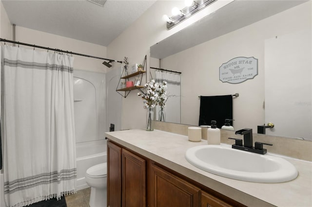 full bathroom with tile patterned flooring, toilet, shower / tub combo with curtain, vanity, and a textured ceiling