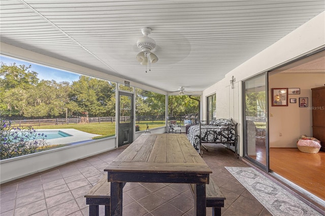 sunroom / solarium with ceiling fan