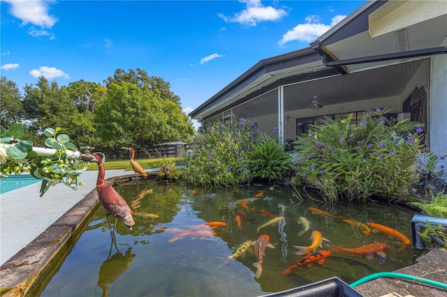 exterior space featuring a small pond