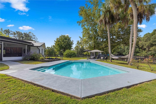 view of swimming pool featuring a lawn, a gazebo, and a patio area