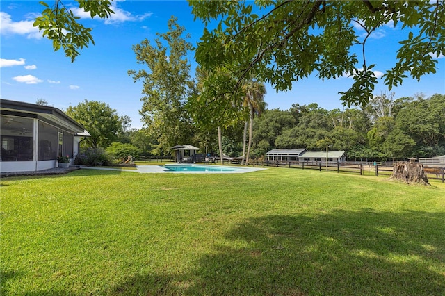 view of yard with a sunroom