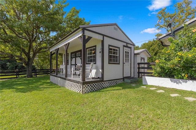 view of side of property with a lawn