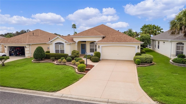 view of front of home featuring a garage and a front lawn