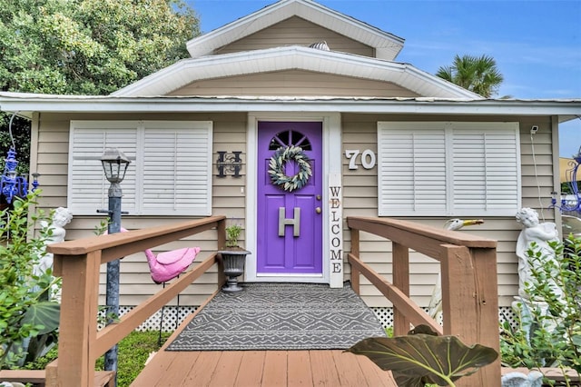 entrance to property with a deck