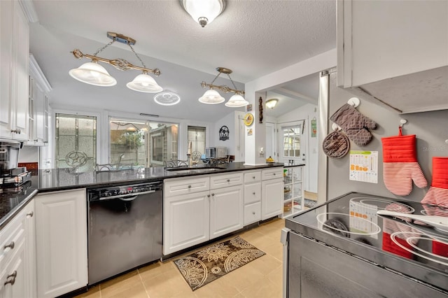 kitchen with a textured ceiling, stainless steel appliances, sink, hanging light fixtures, and white cabinets