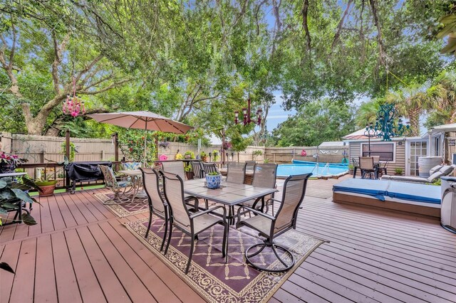 deck with a fenced in pool