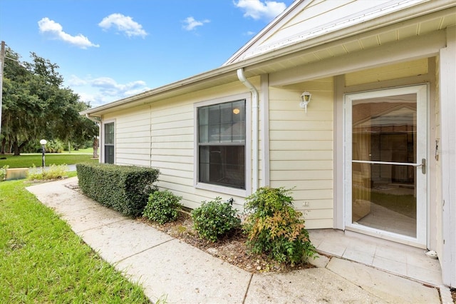 view of property exterior featuring a lawn