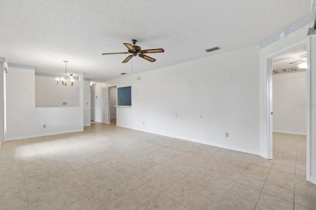 unfurnished room featuring a textured ceiling and ceiling fan with notable chandelier