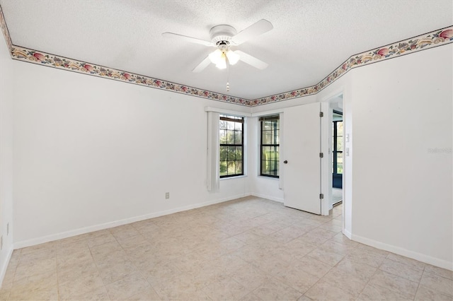 unfurnished room with a textured ceiling and ceiling fan