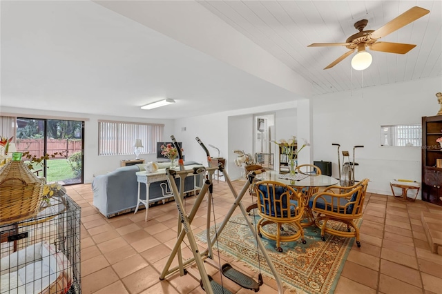 tiled dining space with wooden ceiling and ceiling fan