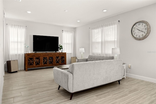 living room with light hardwood / wood-style flooring