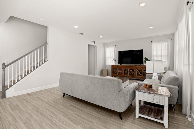 living room with light hardwood / wood-style floors