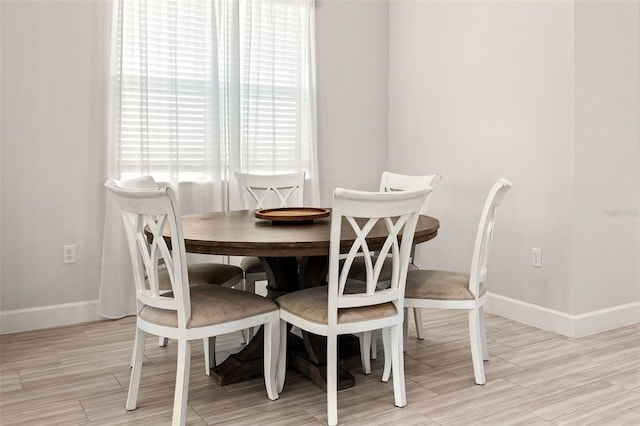 dining room with light wood-type flooring