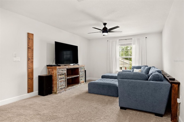 living room with ceiling fan and carpet floors