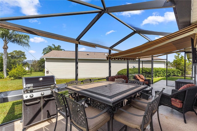 view of patio featuring a grill and glass enclosure