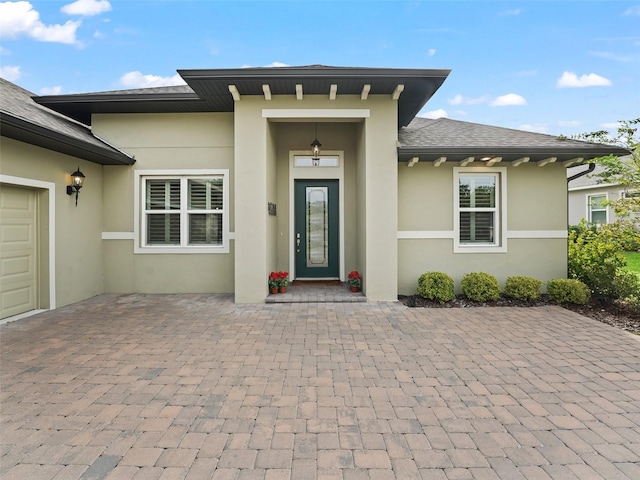 entrance to property featuring a garage