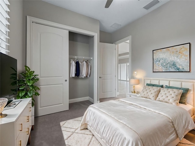 bedroom featuring ceiling fan, a closet, and dark carpet