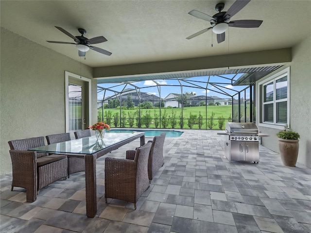 view of patio / terrace with ceiling fan, a lanai, and a grill