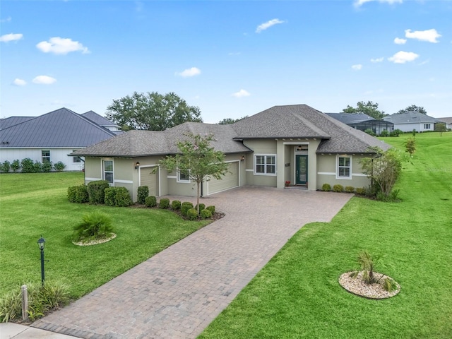 view of front of home featuring a garage and a front yard