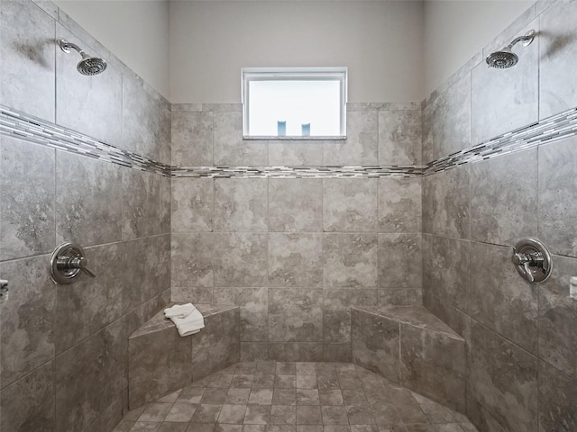 bathroom with tiled shower