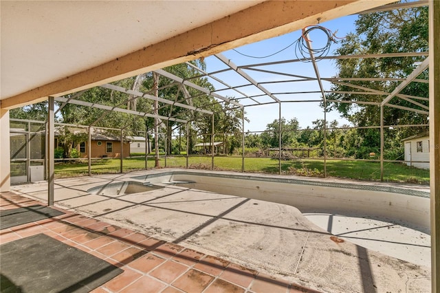 view of patio / terrace featuring a lanai