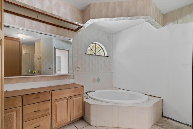 bathroom featuring vanity, plus walk in shower, and tile patterned floors