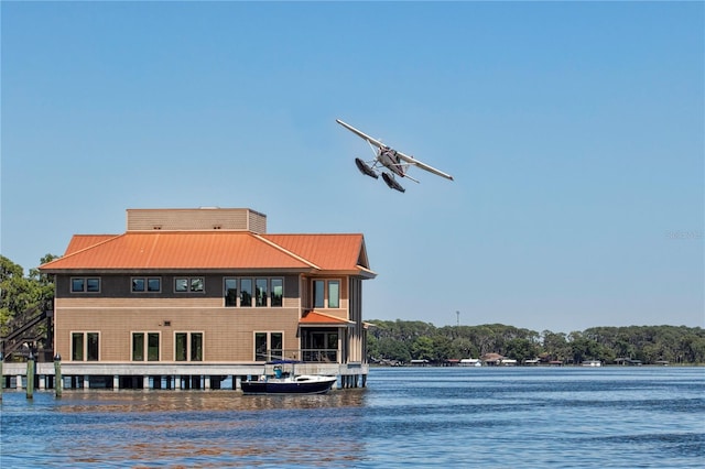 exterior space with a water view