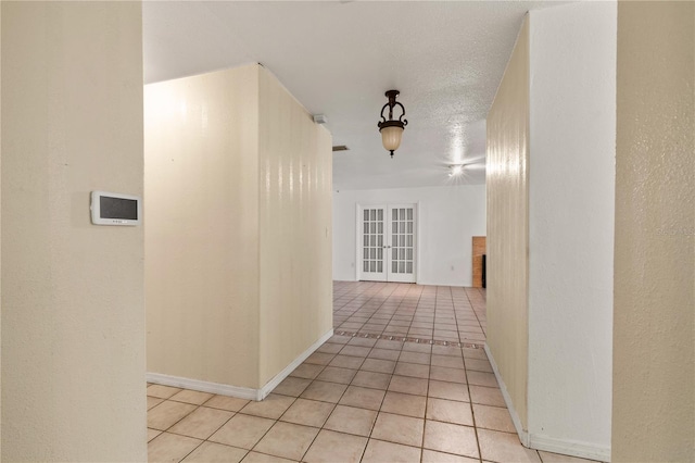 corridor with light tile patterned flooring