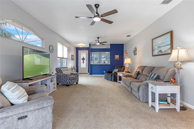 carpeted living room featuring ceiling fan