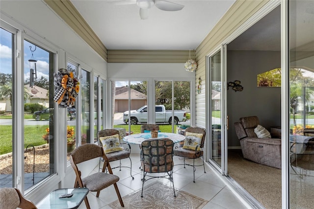 sunroom with ceiling fan and plenty of natural light