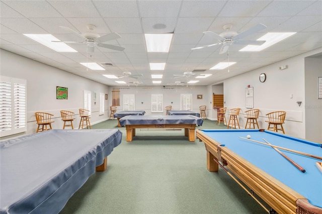 recreation room with pool table, a paneled ceiling, ceiling fan, and carpet flooring