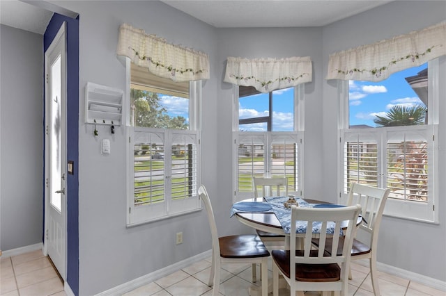 dining area with light tile patterned flooring