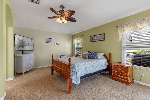 bedroom featuring ceiling fan and light colored carpet