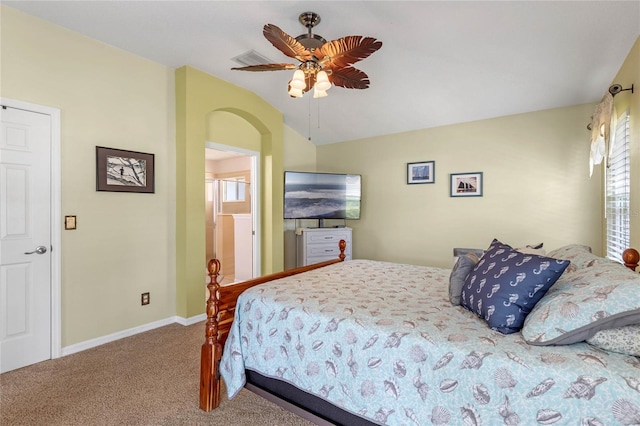 carpeted bedroom with vaulted ceiling and ceiling fan