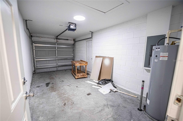 garage featuring concrete block wall, water heater, and a garage door opener