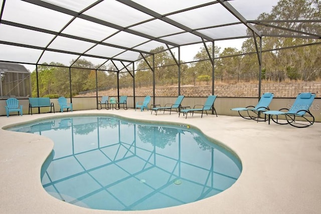 view of pool featuring a patio and a lanai