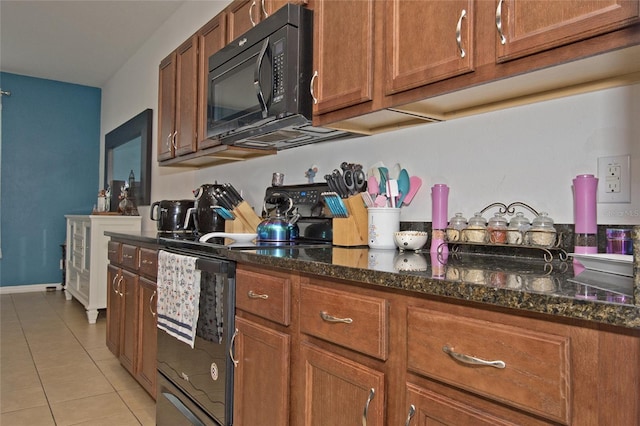 kitchen featuring dark stone counters and light tile patterned floors